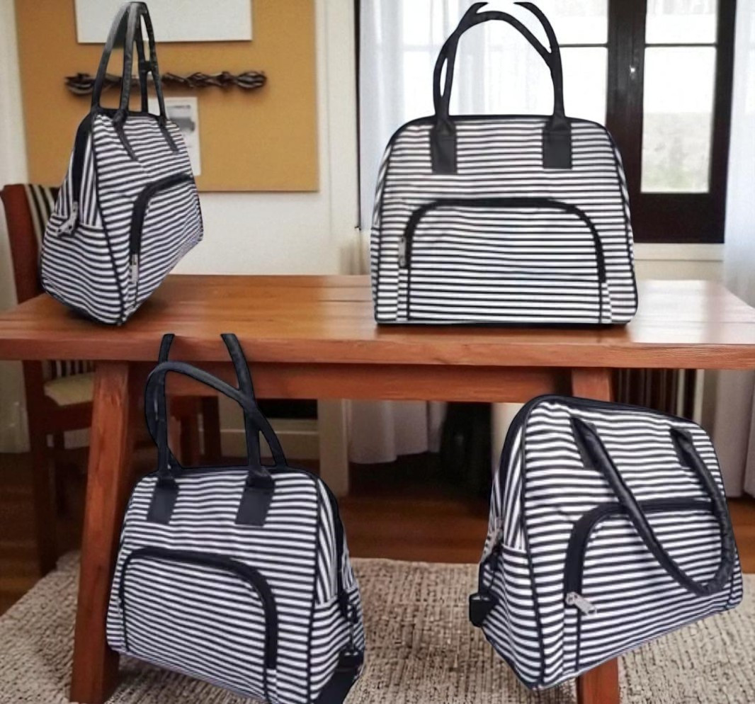 Women , girls white and black duffle bag